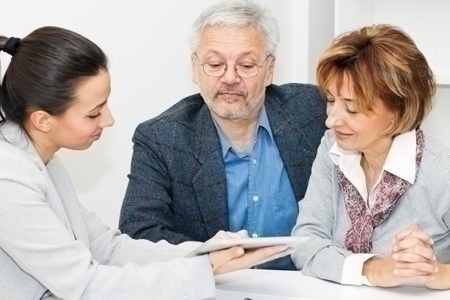 Happy mature Couple in Meeting With Advisor