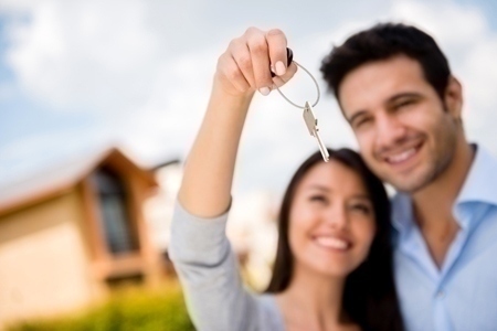 Couple holding house keys