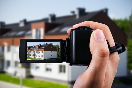 Video camera or camcorder recording new house