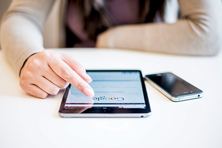 Woman holding Ipad Mini