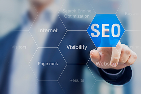 Search Engine Optimization consultant touching SEO button on whi